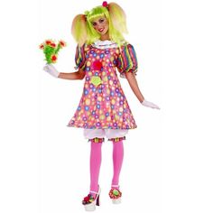 a woman dressed as a clown holding flowers and wearing pink tights, white shoes