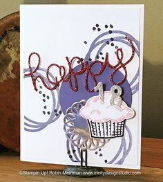 a handmade birthday card with a cupcake and the word happy written on it