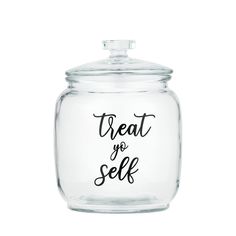 a glass jar with the words treat yo self on it