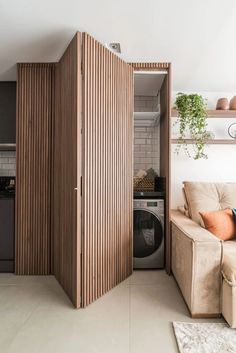 a living room filled with furniture and a washer