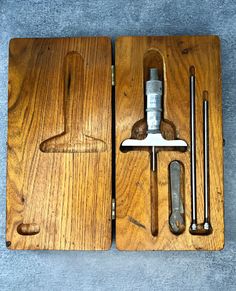 two wooden cutting boards with tools in them