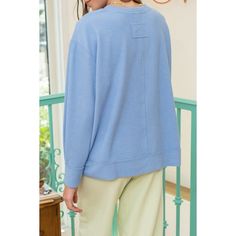 Elevate your everyday style with our August Sky Women's Raw Edge Split Neck Knit Pullover Top. This cozy, ribbed knit top features a modern split neckline and relaxed, comfortable fit. Its trendy dropped shoulders, long sleeves, and raw edge details add a touch of effortless chic. Complete with a split hemline for added flair, this versatile top seamlessly blends comfort and fashion. Ideal for any occasion, it's a must have addition to your wardrobe. Casual Blue V-neck Sweater For Layering, Spring Ribbed V-neck Sweater For Loungewear, Trendy Sweater With Ribbed Neckline For Layering, Spring Everyday Sweater With Ribbed Neckline, Spring Sweater With Ribbed Neckline, Everyday Spring Sweater With Ribbed Neckline, Ribbed Neckline Knit Top For Fall Loungewear, Casual V-neck Sweater In Soft Knit For Loungewear, Fall Knit Top With Ribbed Neckline For Loungewear