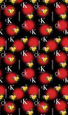 a black background with yellow and red flowers on the bottom, and letters k in the middle