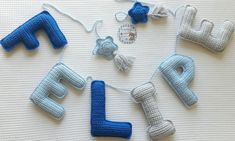 crocheted letters and numbers are laid out on a table