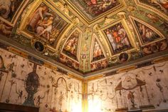 an ornate ceiling with paintings on it