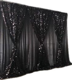 a black curtain with sequins on it