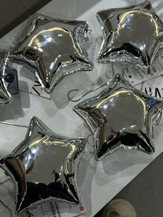 shiny silver star shaped balloons are on display