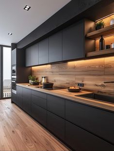 a kitchen with black cabinets and wooden flooring next to a large glass window overlooking the city