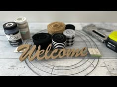 the welcome sign is surrounded by sewing supplies