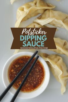 dumplings with dipping sauce and chopsticks on a white plate next to them