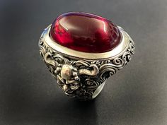 RING PROFILE: 🔱 Indulge in the allure of the 'Devil's Blood Ring,' a captivating piece that embodies the mystique of dark elegance. Crafted with precision and imbued with a touch of the infernal, this ring is a mesmerizing fusion of sophistication and edge. The deep, crimson hues evoke a sense of forbidden passion, while the intricate design channels the essence of the occult. Elevate your style with this unique accessory that beckons the daring and those drawn to the darker realms. The Devil's Blood Rings, Blood Jewelry, Blood Ring, Vampire Accessories, Vampire Ring, Vampire Jewelry, Blood Ruby, Dark Elegance, Exotic Jewelry