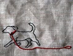 a dog is on the ground with a red string