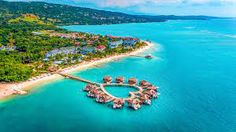 an aerial view of the resort and its surrounding lagoons in the middle of the ocean