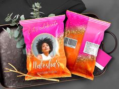 two bags of hair products sitting on top of a tray