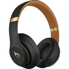 the beats on ear headphones are black and gold