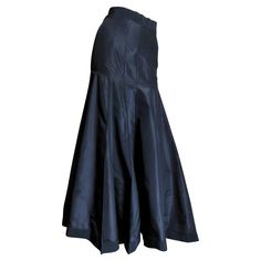 A beautiful black silk taffeta skirt from Angelo Tarlazzi. It has a grosgrain waistband and vertical panels semi fitted though to the hips then flaring to the hem. The skirt has grosgrain around the hem also and it is unlined with a center back zipper and a button at the waist. Fits Extra Small, Small. Waist 25" Hips 37" Length 38.50" Taffeta Skirt, Silk Maxi Skirt, Slim Aarons, Silk Taffeta, Silk Maxi, Small Waist, Black Silk, A Button, Yves Saint Laurent