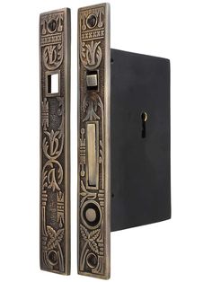 an antique style door handle with decorative designs on it's front and back panels