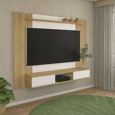 a living room with a large flat screen tv mounted to the side of a wall