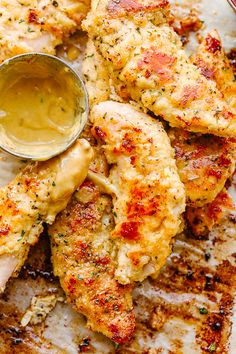 chicken wings with mustard and ketchup on a plate