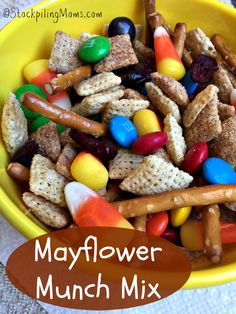 a yellow bowl filled with candy corn snack mix