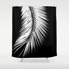 a black and white palm leaf shower curtain