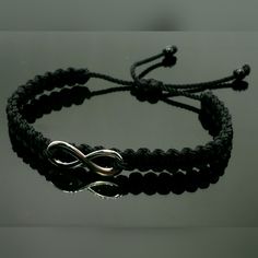 Fashionable And Durable Hand-Made Black String Bracelet With An Infinity For Wrist Sizes 6 To 9 Inches, With An Easy To Use Zip Like Function To Fit Your Wrist, You'll Have It On As Soon As You Get It. Made From High Quality Black String, It Will Be Sure To Last. Each Bracelet Is Carefully Handcrafted And Given Proper Time To Ensure Quality. Fast Shipping Adjustable Silver Stainless Steel Braided Bracelet, Trendy Black Sterling Silver Jewelry, Adjustable Black Metal Bracelets, Silver Metal Bracelets With Black Band, Silver Metal Bracelet With Black Band, Casual Silver Infinity Jewelry, Trendy Adjustable Silver Friendship Bracelets, Adjustable Nickel Free Black Jewelry, Adjustable Nickel-free Black Jewelry