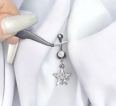 Super cute handmade y2k 2000s silver diamond rhinestone star flower dangling belly piercing ring bar.  Can't find anywhere else!  Surgical steel  FREE STANDARD UK SHIPPING Silver Star Belly Rings, Silver Dangle Belly Rings Nickel Free, Nickel-free Silver Dangle Belly Rings, Silver Dangle Body Jewelry With Internally Threaded Design, Adjustable Silver Star Belly Ring, Nickel-free Silver Dangle Body Jewelry, Dainty Silver Dangle Piercings, Silver Dangle Single Earring Body Jewelry, Silver Dangle Earrings Y2k Style