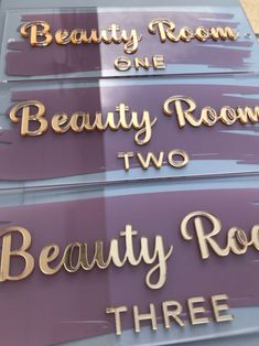 there are three signs that say beauty room, two beauty room and three bed rooms