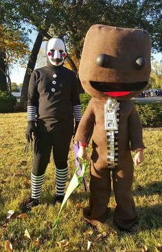 two people in costumes standing next to each other