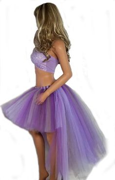 Introducing the Purple and Silver Tutu - a radiant addition to any wardrobe that promises to light up any room you enter. Crafted with care and attention to detail, this stunning skirt offers you the choice of three distinct styles: the elegant bustle style, the playful short mini skirt style, or the sophisticated medium to long style. With just a click, you can select your preferred style from the dropdown menu, allowing you to tailor your look to suit any occasion. Opting for the bustle style Stretch Skirt For Spring Costume Party, Purple Lined Skirt For Party, Tulle Skirt For Costume Party, Purple Lined Party Skirt, Stretch Mini Skirt For Costume Party, Purple Tulle Party Skirt, Purple Stretch Tiered Skirt, Lined Skirt For Summer Costume Party, Purple Flowy Party Skirt