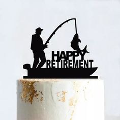 a cake topper that says happy retirement with a fishing scene on it and a fisherman