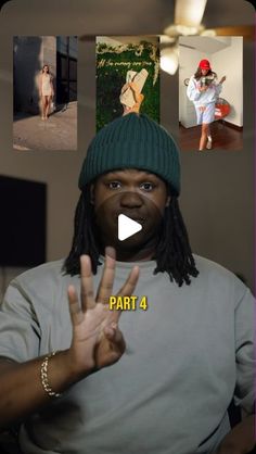 a man with dreadlocks and a beanie making the peace sign in front of him