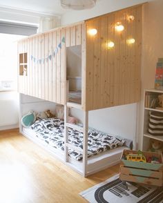 a child's bedroom with bunk beds and toys