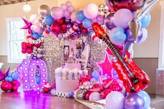 balloons, streamers and decorations are on display at a birthday party