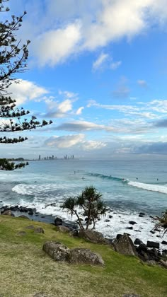 an ocean view with waves crashing on the shore