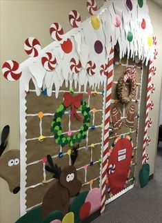 an office cubicle decorated for christmas with decorations and candy canes on the door