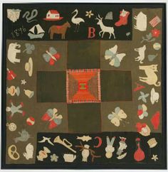 an image of a quilt with animals and letters on it