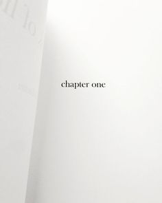 an open book with the word'chapter one'written in black ink on it