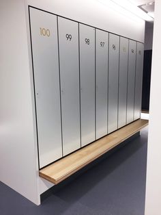 a row of white lockers sitting next to each other