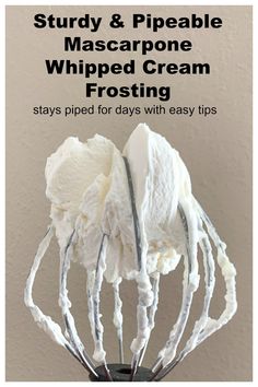 a whisk with whipped cream in it and the words, study & pipeable mascarpone whipped cream frosting