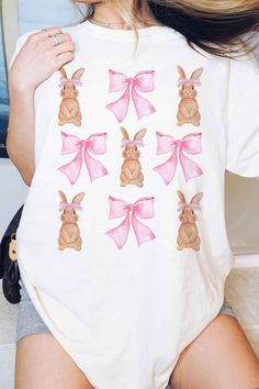 Cute Coquette easter Sweatshirt or Tshirt we have sizes running from kids to adults. Please make sure to choose your sizing. Easter bunny Shirt cute for kids and adults. Coquette clothing Pink ribbon with Cute Bunnys Q U I C K * F A C T S * ♥️ 100% Soft cotton ♥️Design is high quality digital print ♥️ Wash and dry normally. Do not iron directly on the print. * S I Z I N G * ♥️ Sizing is unisex so runs like men's ♥️Most women find their typical size works best. ♥️ Please see size guide in last li Cute White T-shirt With Bunny Design, Cute Short Sleeve Easter T-shirt, Cute Cotton Tops With Bunny Design, Cute Cotton Top With Bunny Design, Cute Bunny Design Crew Neck T-shirt, Summer Cotton Tops With Bunny Design, Summer Cotton Top With Bunny Design, Pink Crew Neck Top With Bunny Design, Playful Easter Short Sleeve T-shirt