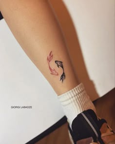 a woman's foot with a tattoo on it