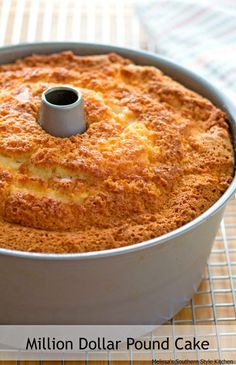 a cake in a pan sitting on top of a table next to a cooling rack