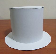 a white paper hat sitting on top of a wooden table