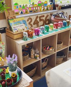 a table filled with lots of toys and baskets