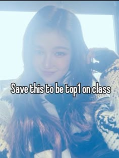 a girl with long brown hair wearing a white and black sweater holding her hand up to her ear