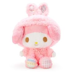 a small stuffed animal wearing a pink bunny outfit and holding an egg in it's hand