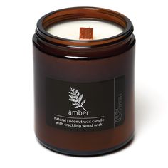 a candle that is sitting in front of a white background with the words blood orange sage on it