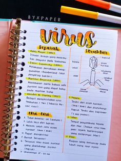 an open notebook with the words virs written on it next to two pencils