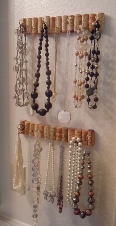 a wall mounted jewelry rack with lots of beads